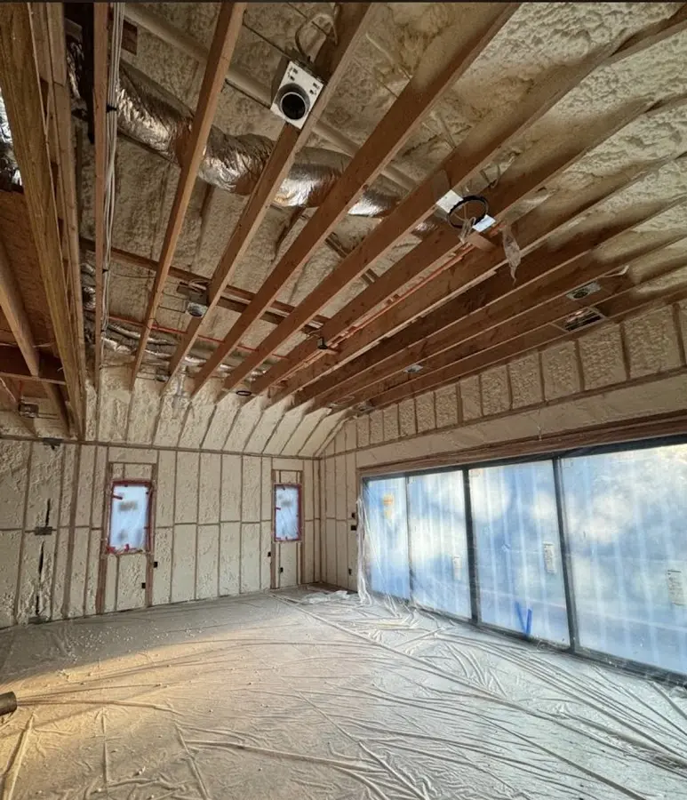 Interior walls and ceiling insulated with spray foam during new construction in Hermantown